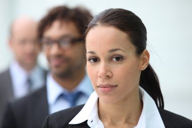 A businesswoman with her colleagues clipart