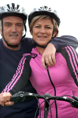 Mature cyclist couple clipart