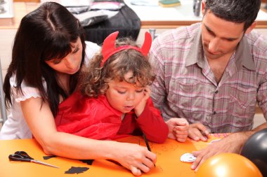 Family doing Hallowe'en activities clipart