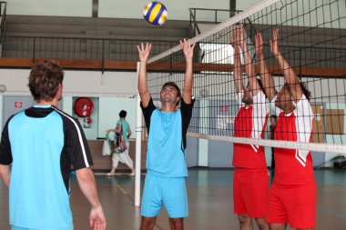 Volley-ball players in action clipart