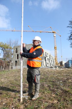 A foreman taking measure. clipart