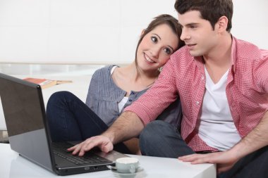 Couple with a laptop clipart