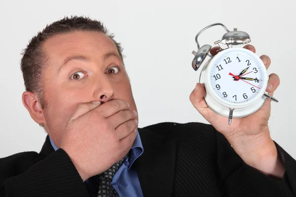 Man shocked to discover the time — Stock Photo, Image