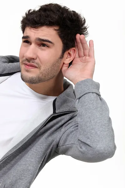 Příležitostné muž snaží slyšet — Stock fotografie
