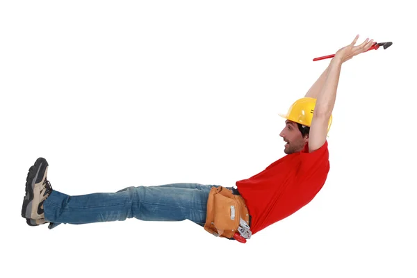 Tradesman jumping in the air — Stock Photo, Image