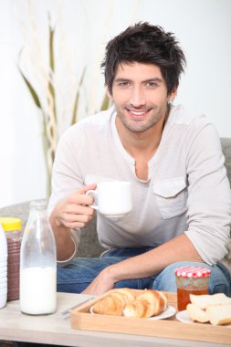 Man having breakfast clipart