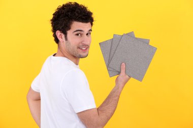 Portrait of handyman installing tiles clipart