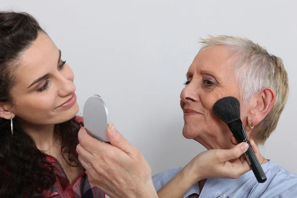 Make-up artist with customer — Stok fotoğraf