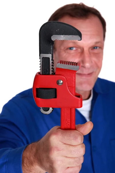 Plumber holding large tool — Stock Photo, Image