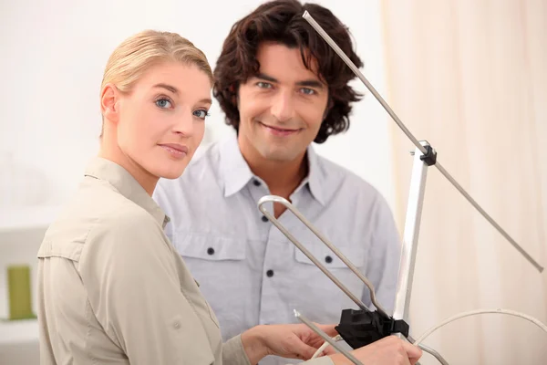 Couple with a television antenna — Stock Photo, Image