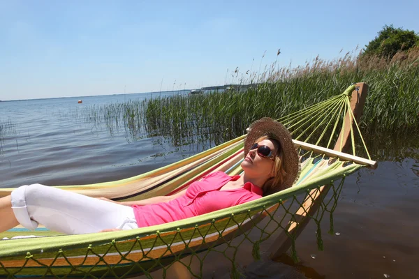 stock image Woman in hammock by lake