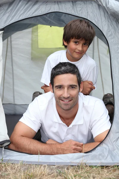 Father and son in a tent — Stock Photo, Image