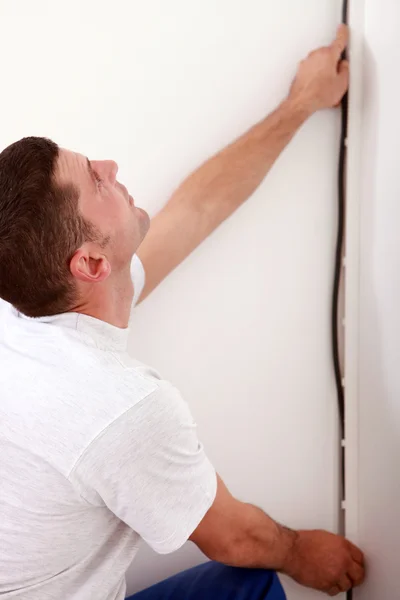 Electrician installing cable — Stock Photo, Image
