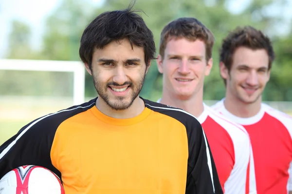 Drie voetballers — Stockfoto
