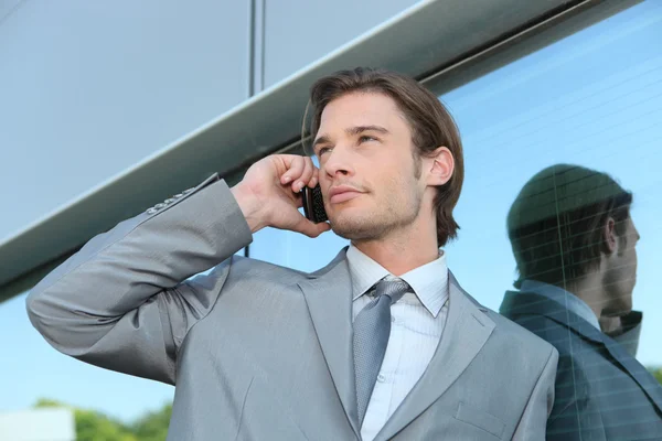 Young executive using a cellphone — Stock Photo, Image