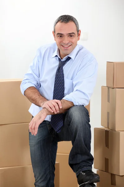 Ware house manager surrounded by boxes — Stock Photo, Image