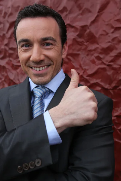 Businessman giving the thumbs up — Stock Photo, Image
