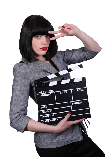 Stylish woman with a movie clap board — Stock Photo, Image