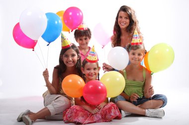 Children at a birthday party clipart