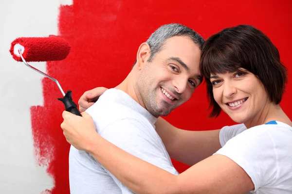 Couple of diy painting it red — Stock Photo, Image