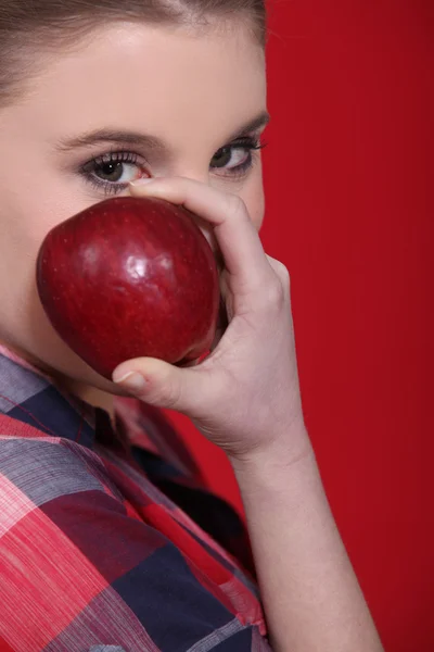 Woman with a red apple — Stock Photo, Image