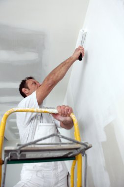 Painter using roller clipart