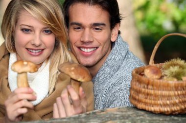 Couple looking at mushrooms clipart