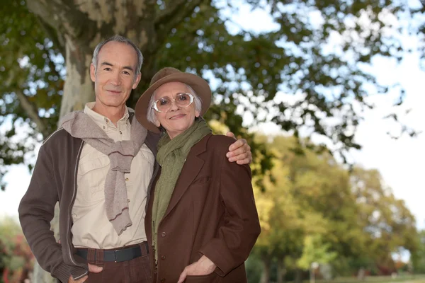 Elderly couple in the forest — Stock Photo, Image