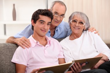 Family looking at photo album clipart