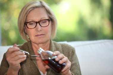 Grandmother pouring syrup clipart