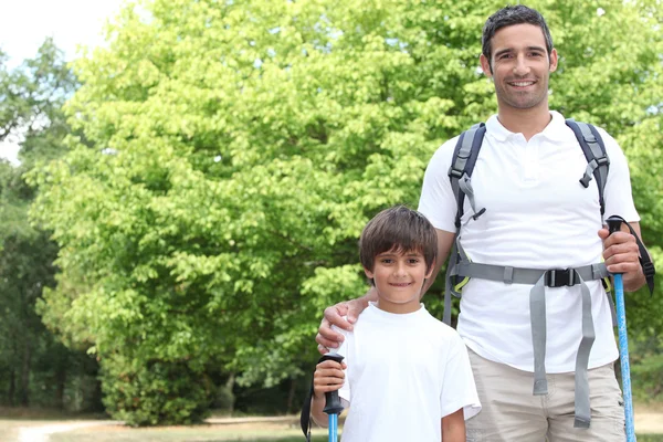 Father and son walking in the park — Stock Photo, Image