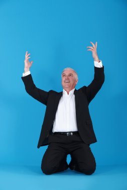 Businessman on his knees clipart