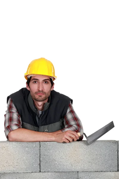 Young mason holding a trowel — Stock Photo, Image