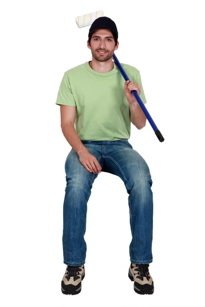 Decorator with a paint roller — Stock Photo, Image