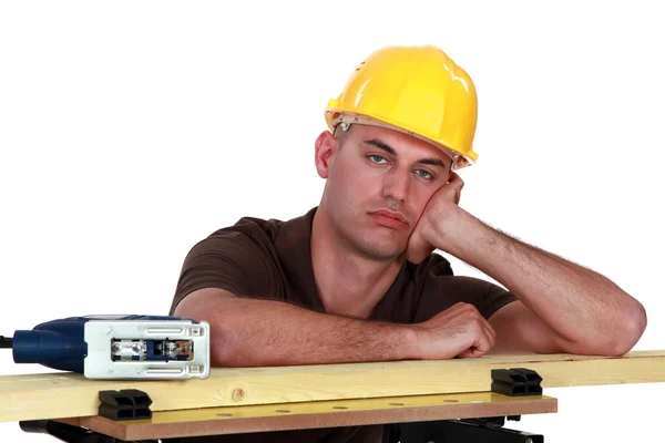 A bored carpenter. — Stock Photo, Image