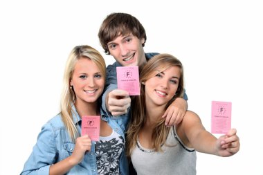 Three teenagers with driving licences clipart