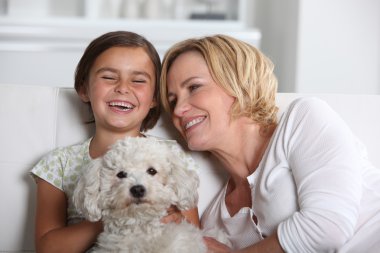 Mother, daughter and the dog clipart