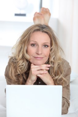 Woman on laptop clipart