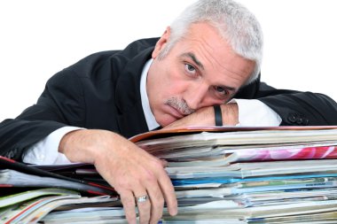 Man lying on paperwork clipart