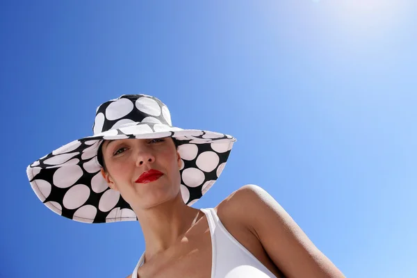 Portrait of woman with hat by summertime — Stock Photo, Image
