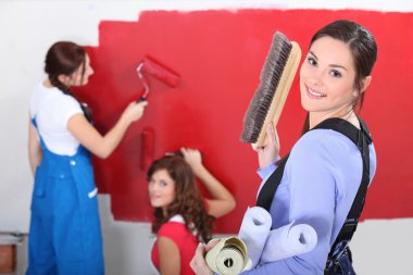 Woman painting wall clipart