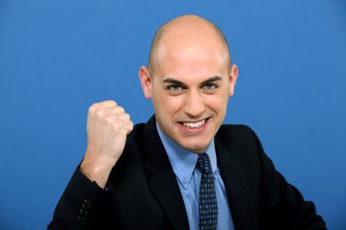 Businessman in suit tight-fisted clipart