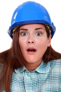 Shocked woman in a hard hat clipart