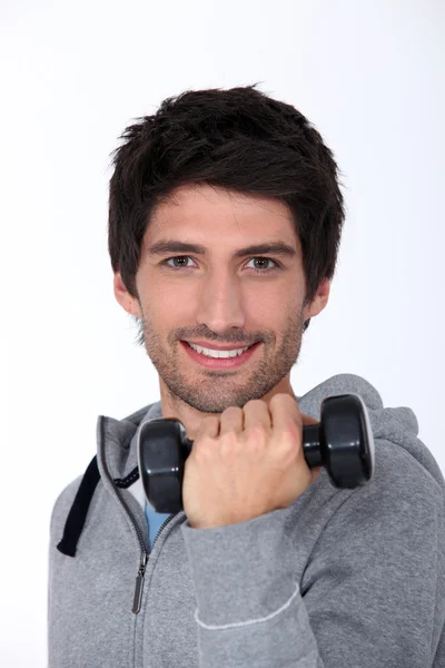 Man with a dumbbell — Stock Photo, Image