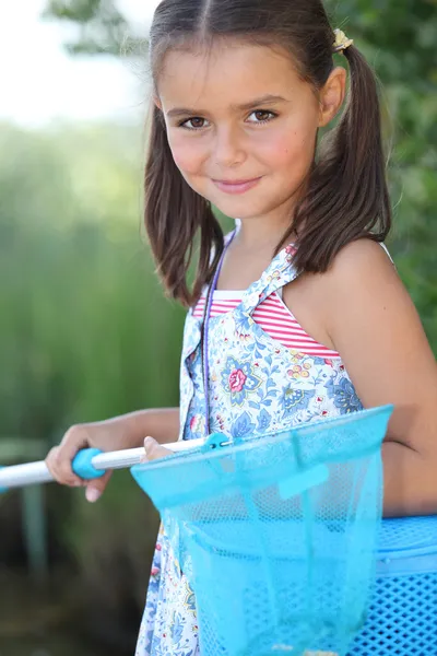 Junges Mädchen mit einem Fischernetz — Stockfoto