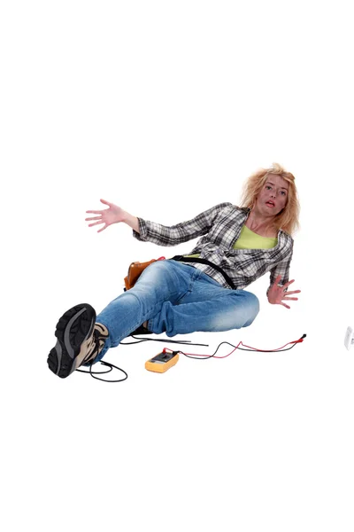 A shocked female electrician. — Stock Photo, Image