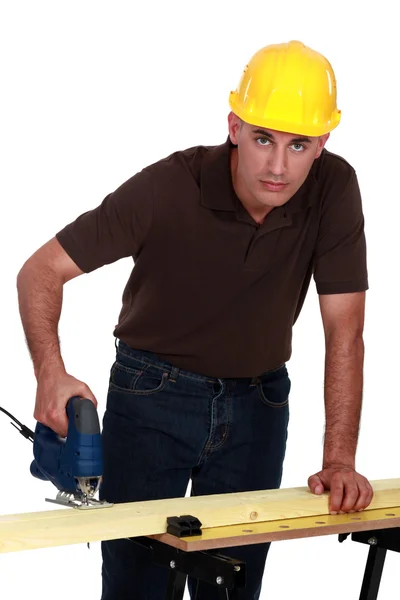 Craftsman making holes in a board with a drill — Stock Photo, Image