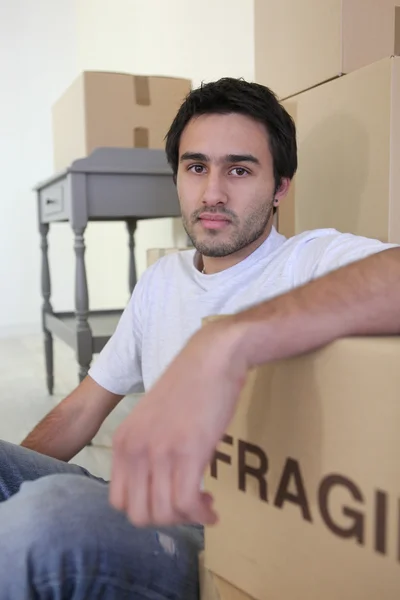 A tired man on moving day — Stock Photo, Image