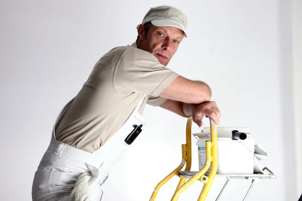 Decorator stood at top of ladder — Stock Photo, Image