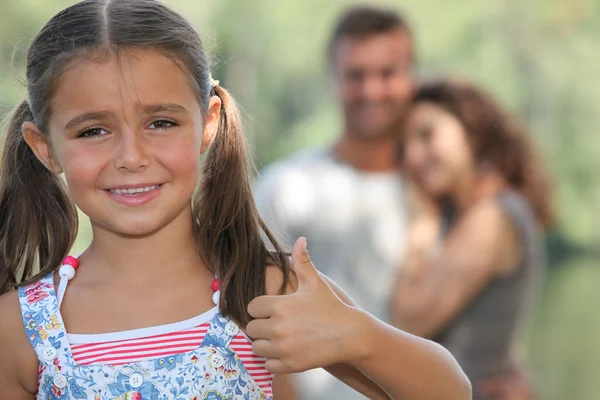 Little girl giving thumbs-up gesture — Stock Photo, Image